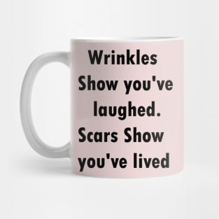 Wrinkles show you've laughed.scars show you've lived Mug